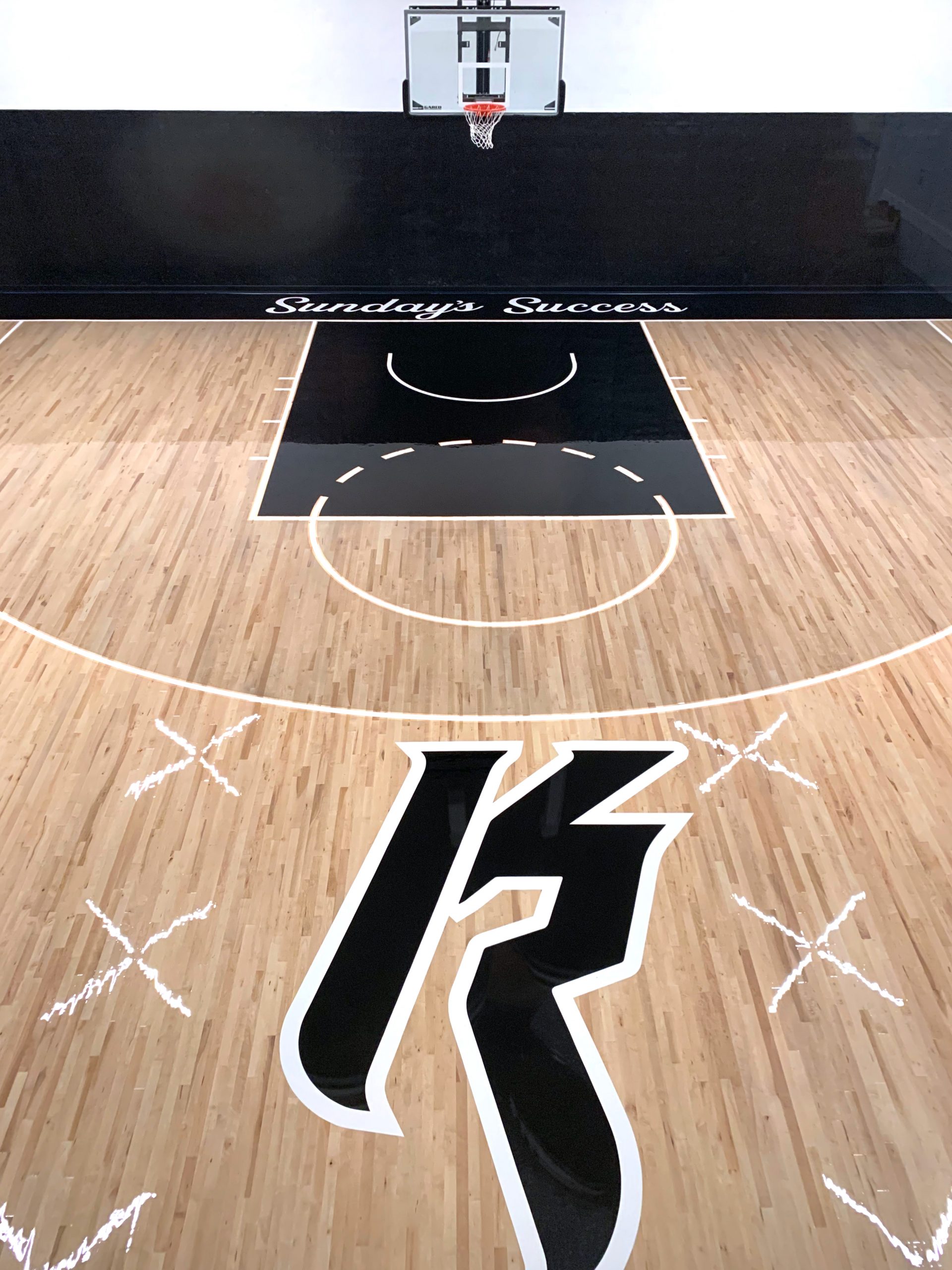 Custom home basketball court installations using 2nd and better maple flooring.