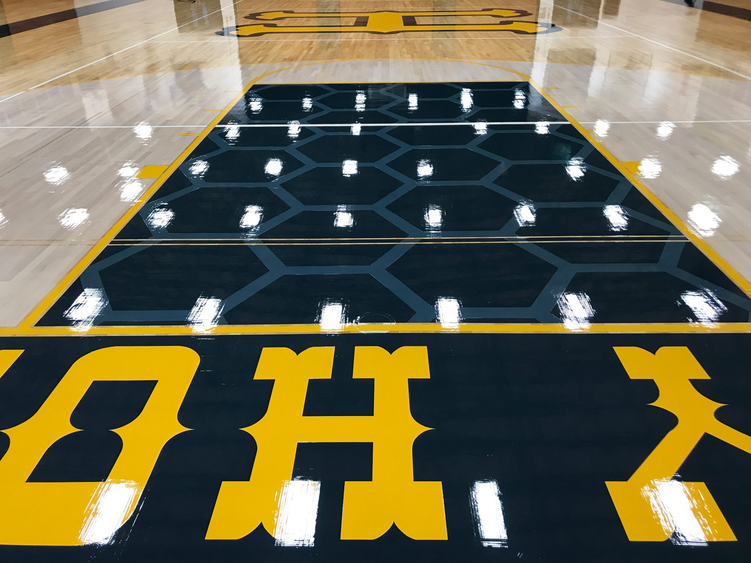 Honey comb pattern painted in the keys of Henley High School by COURTSPORTS