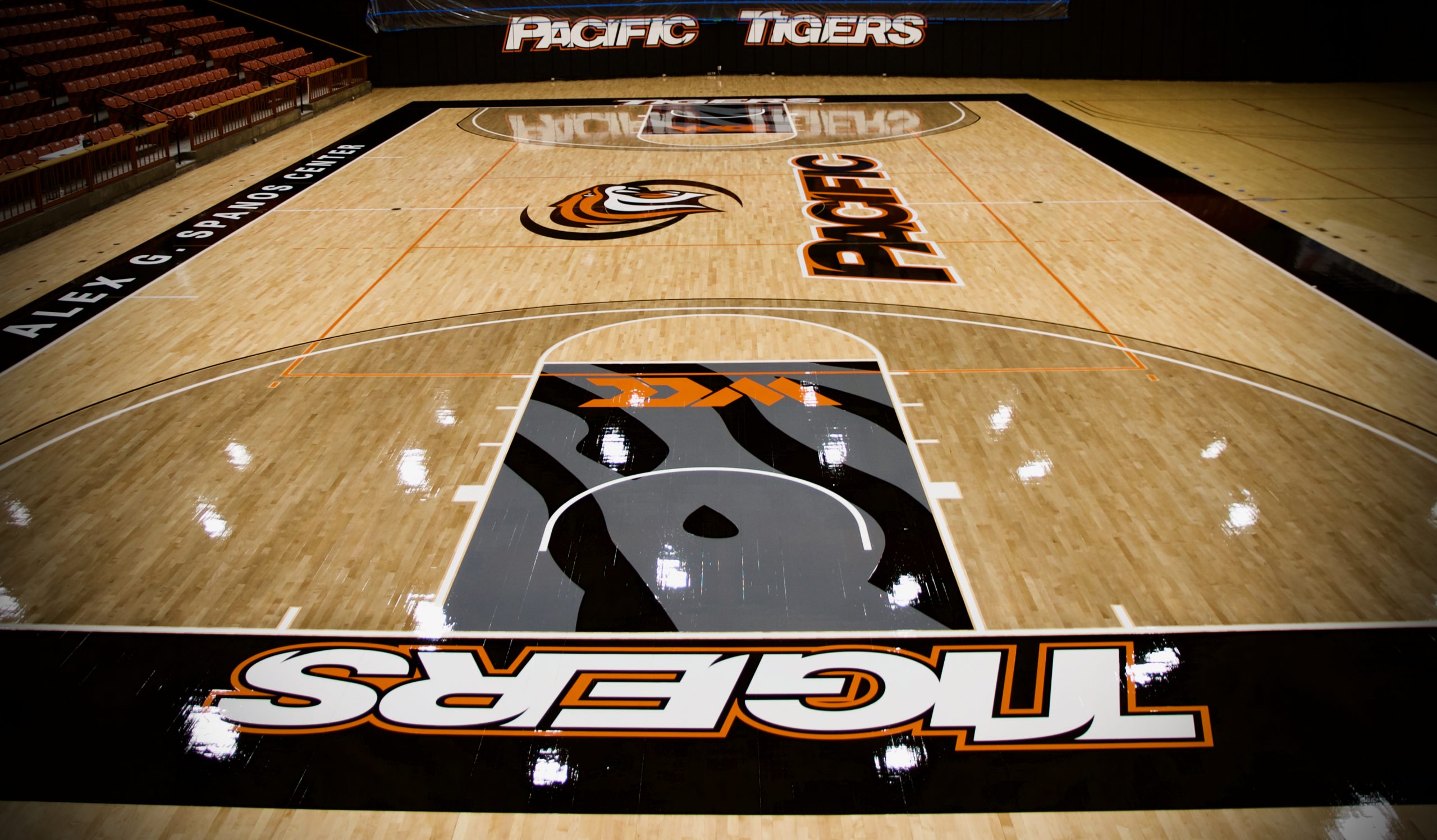 University of the Pacific in Stockton, California. Drum sanding & refinishing of a collegiate basketball court.