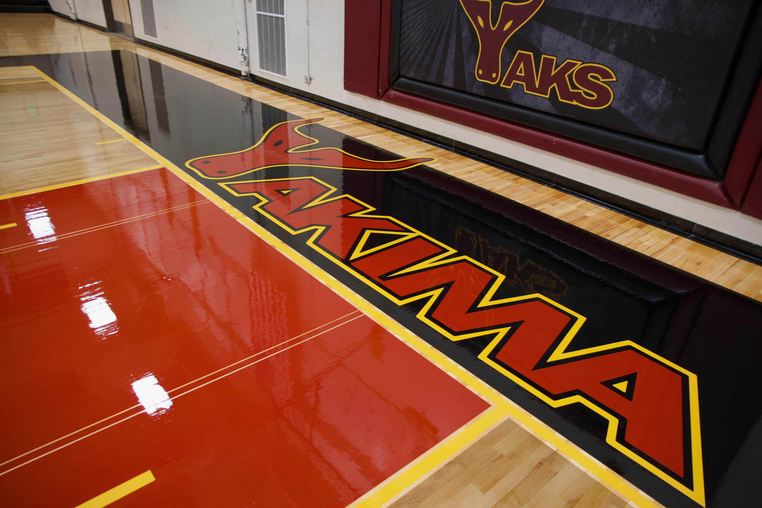 Yakima Valley College, Yakima, Washington - full sanding & refinishing by COURTSPORTS. Solid painted borders, baseline lettering, game lines, followed by two coats of gloss finish.