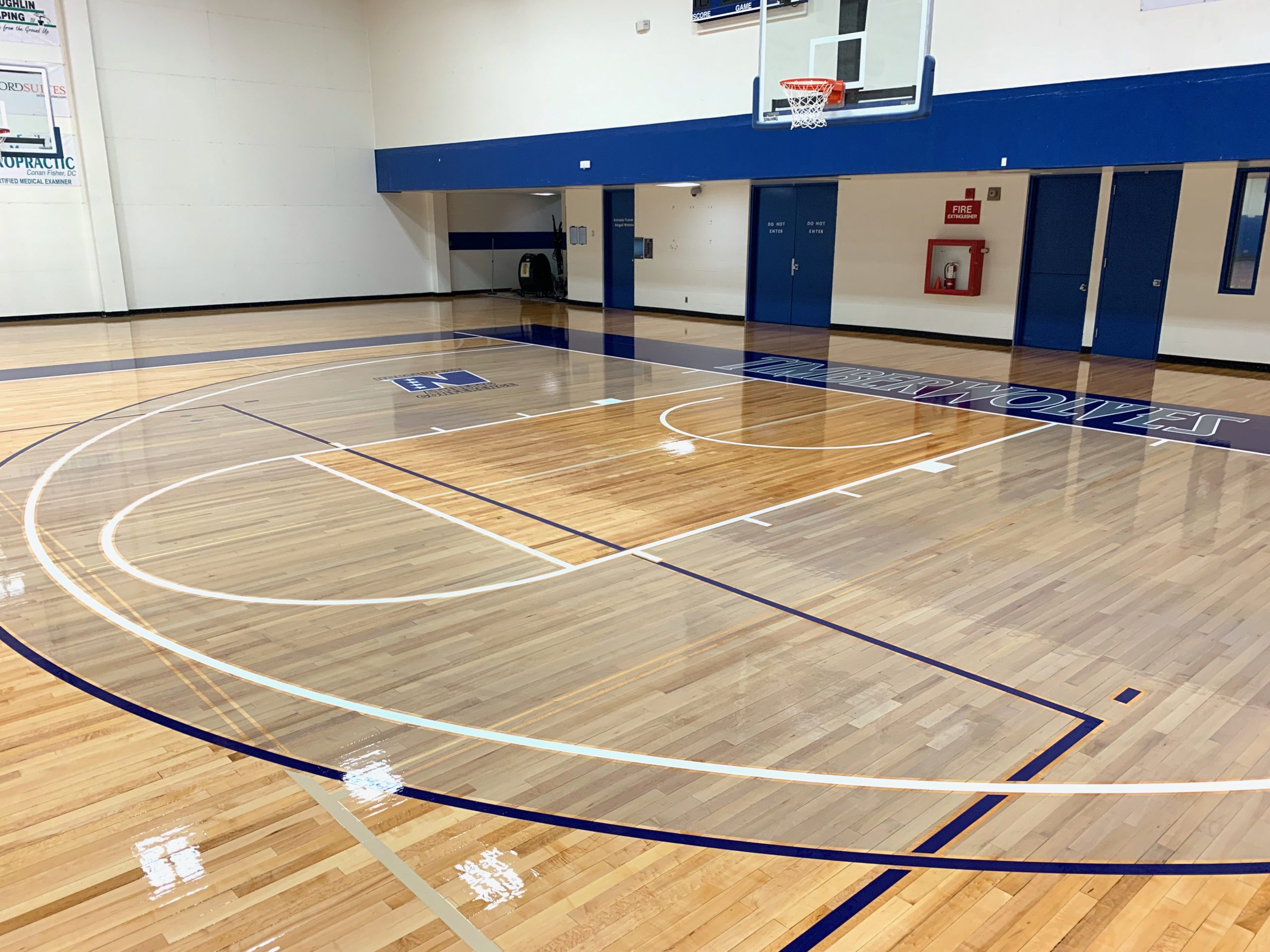 Basketball gym floor tinted 3-point areas by COURTSPORTS