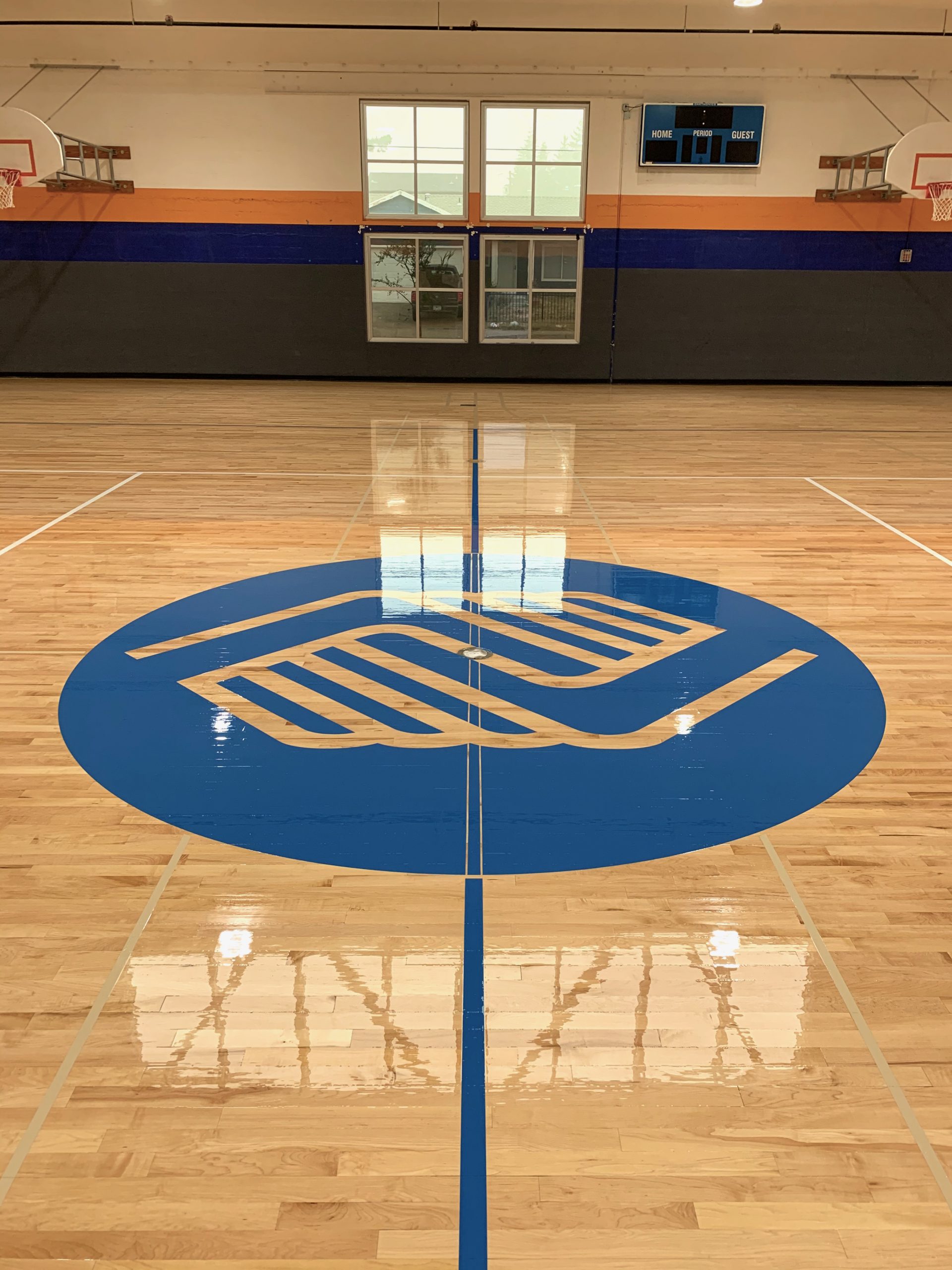 Boys & Girls Club, Portland, Oregon - full sanding & refinishing of their basketball gym floor. Followed by two seals coats using our hybrid sealer, paint game lines and logos, and two coats of oil-modified urethane gym floor gloss.
