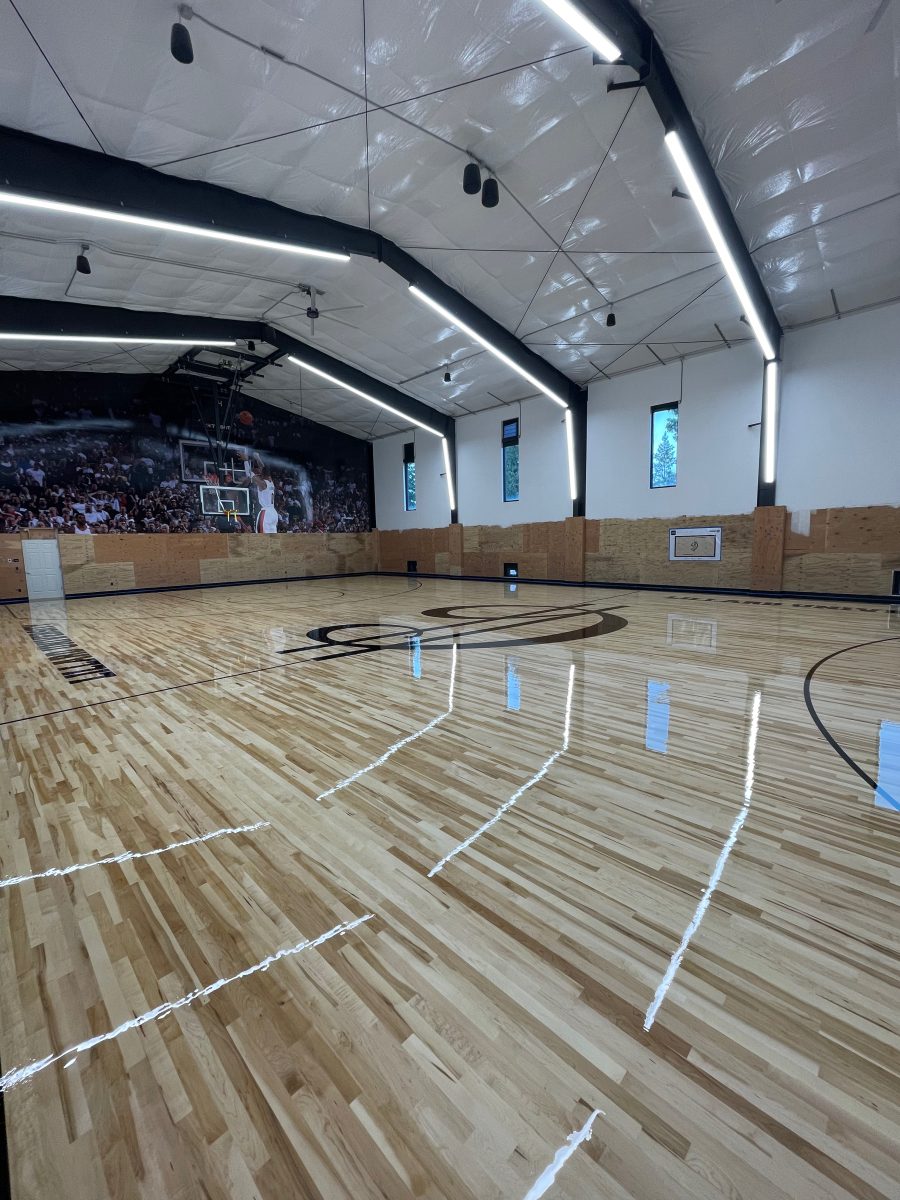 New NBA home court installed for an NBA player who played for the Portland Trail Blazers. Full NBA court sub floor, new maple flooring installed, sanded, sealed, game lines and logos painted